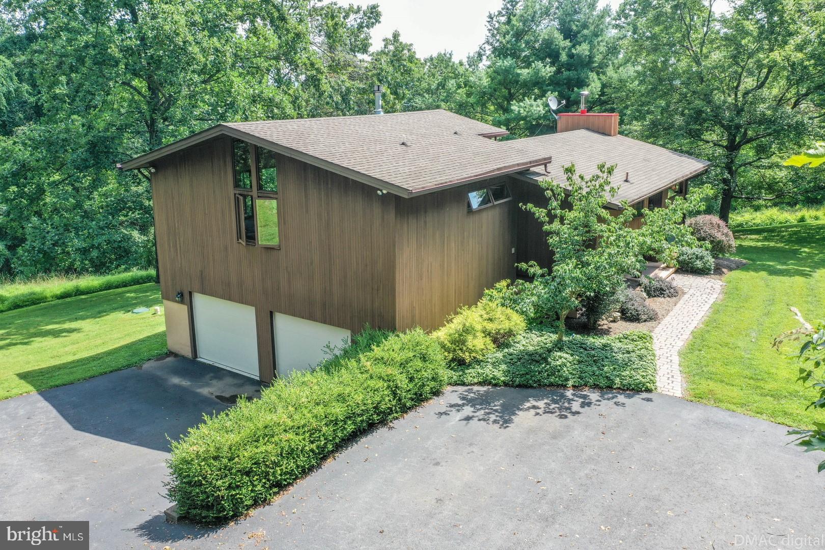 1708 Dahlgren Road Middletown, MD 21769 - Photo 2 of 60 a view of a house with a yard plants and large tree