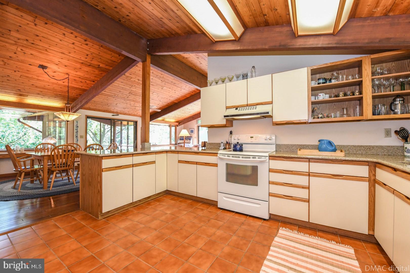 1708 Dahlgren Road Middletown, MD 21769 - Photo 11 of 60 a kitchen with a white cabinets and wooden floor