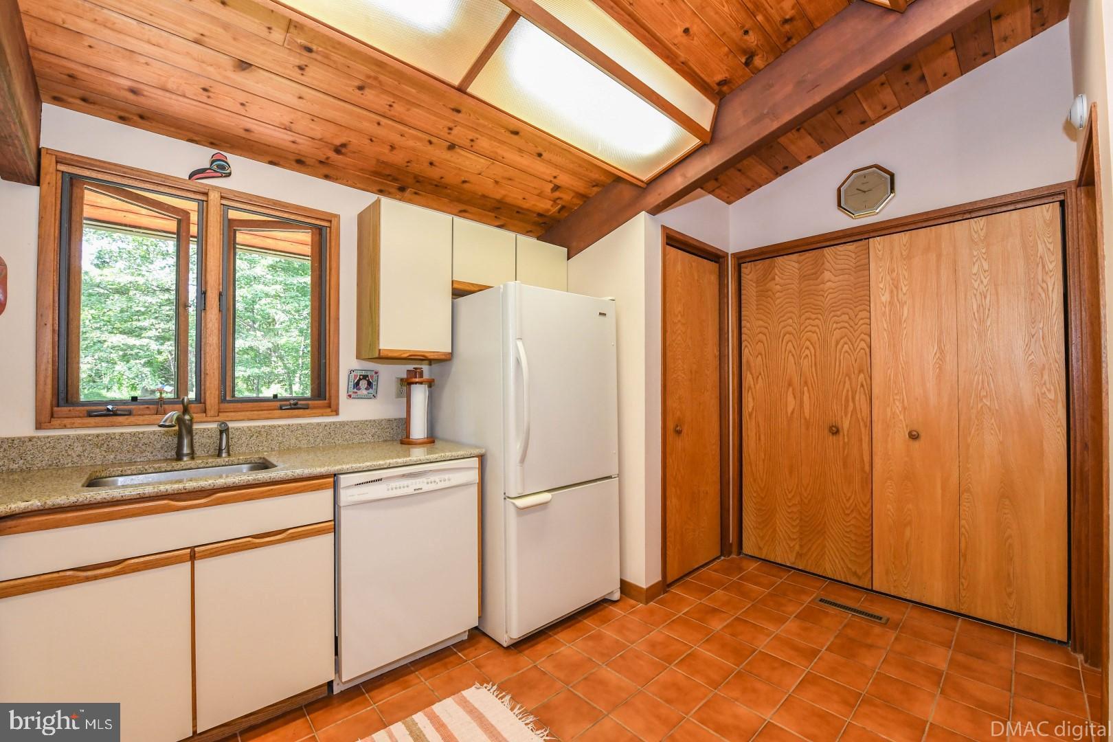 1708 Dahlgren Road Middletown, MD 21769 - Photo 13 of 60 a kitchen with a refrigerator a sink and cabinets