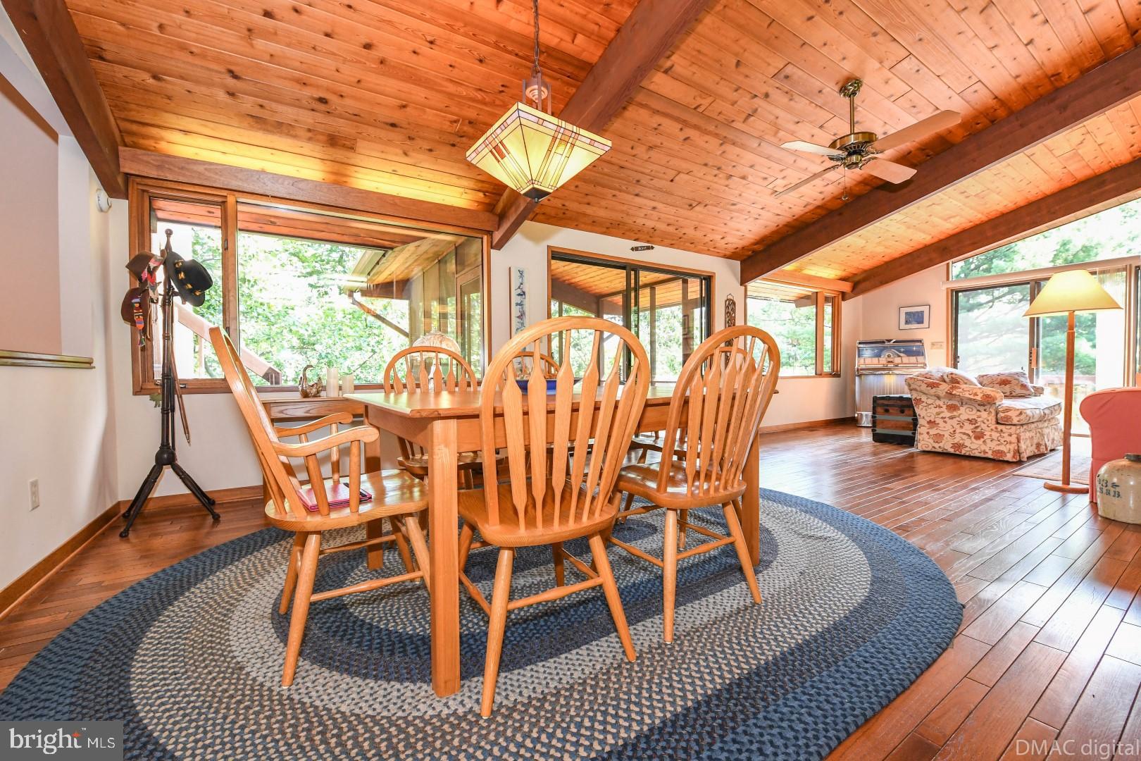 1708 Dahlgren Road Middletown, MD 21769 - Photo 14 of 60 a dining room with furniture a chandelier and wooden floor