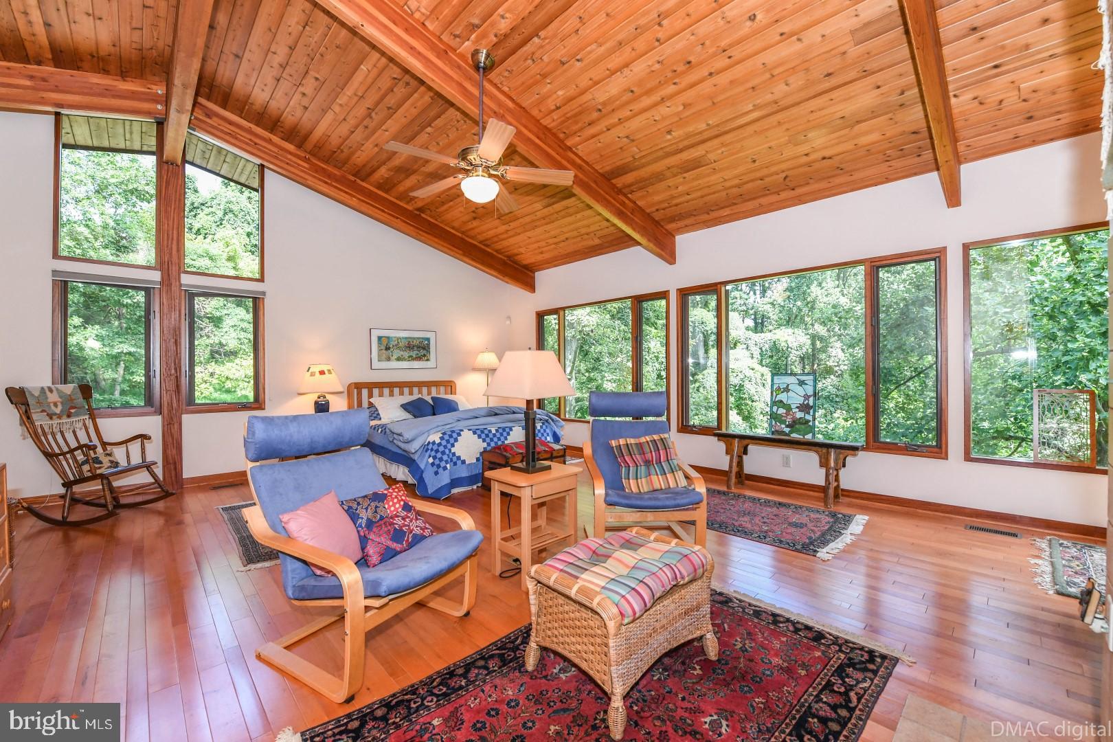 1708 Dahlgren Road Middletown, MD 21769 - Photo 15 of 60 a living room with furniture a large window and wooden floor