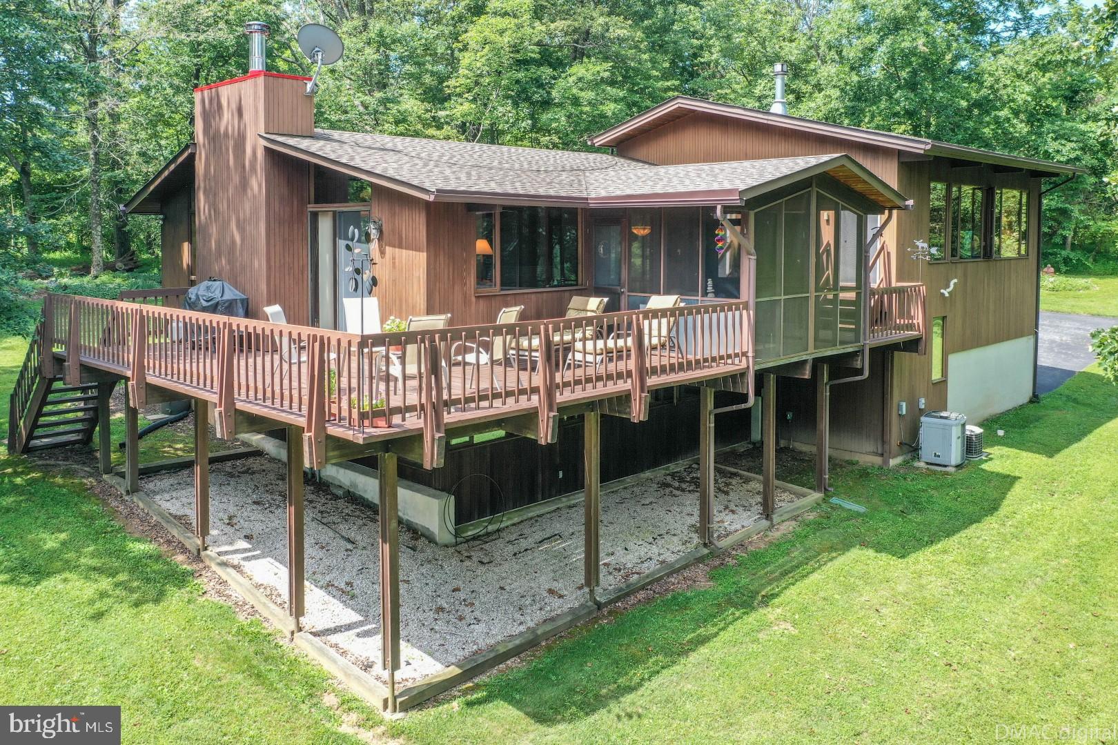1708 Dahlgren Road Middletown, MD 21769 - Photo 3 of 60 a view of a house with a yard and deck