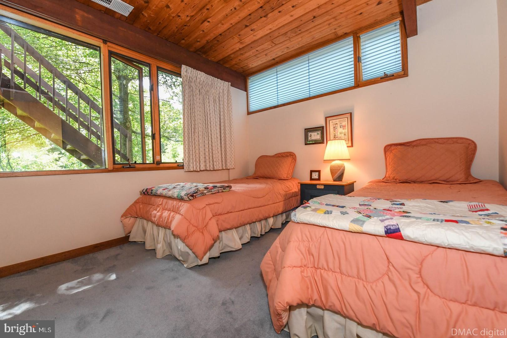 1708 Dahlgren Road Middletown, MD 21769 - Photo 25 of 60 a bedroom with two beds and a large window