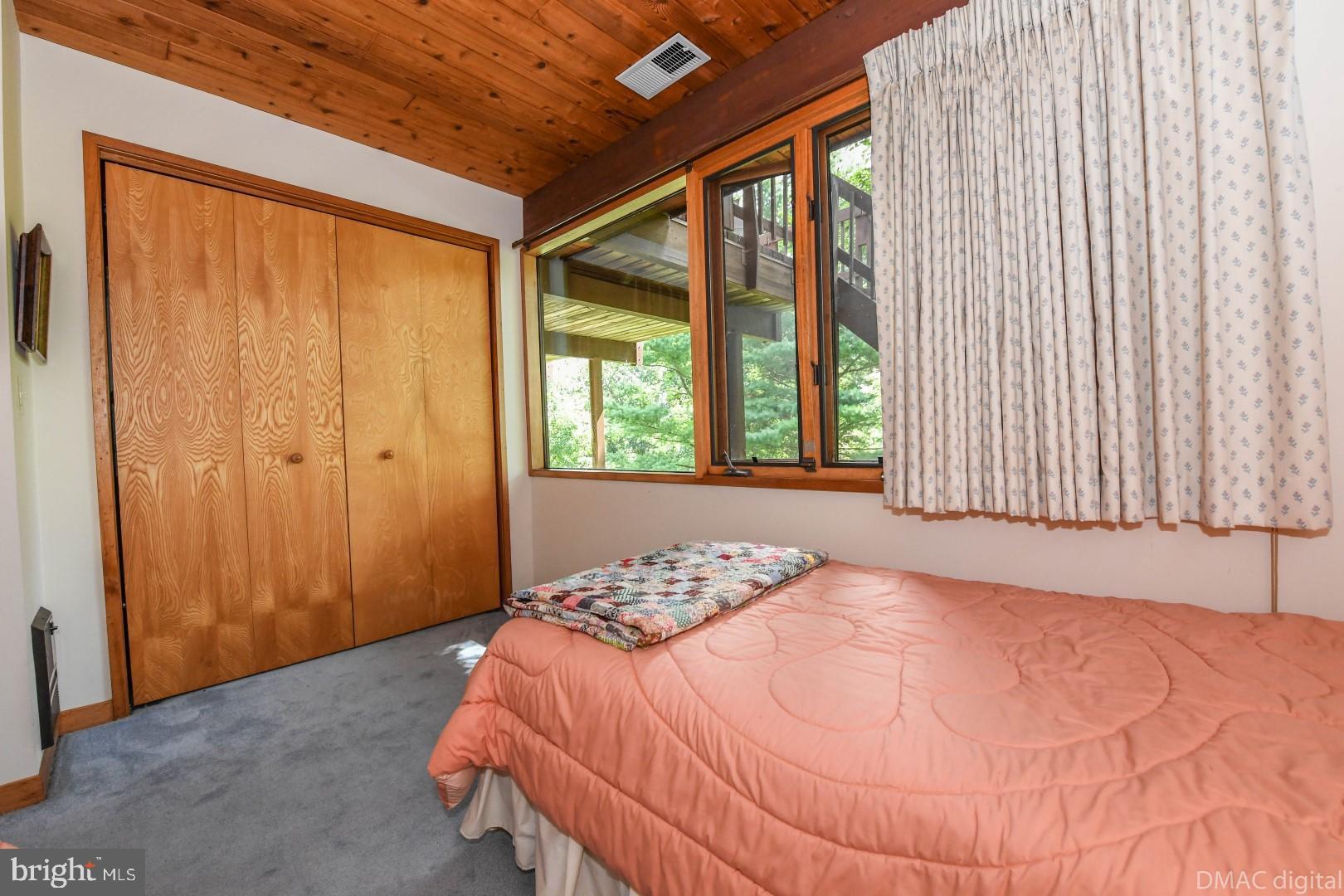 1708 Dahlgren Road Middletown, MD 21769 - Photo 26 of 60 a bedroom with a bed and a window