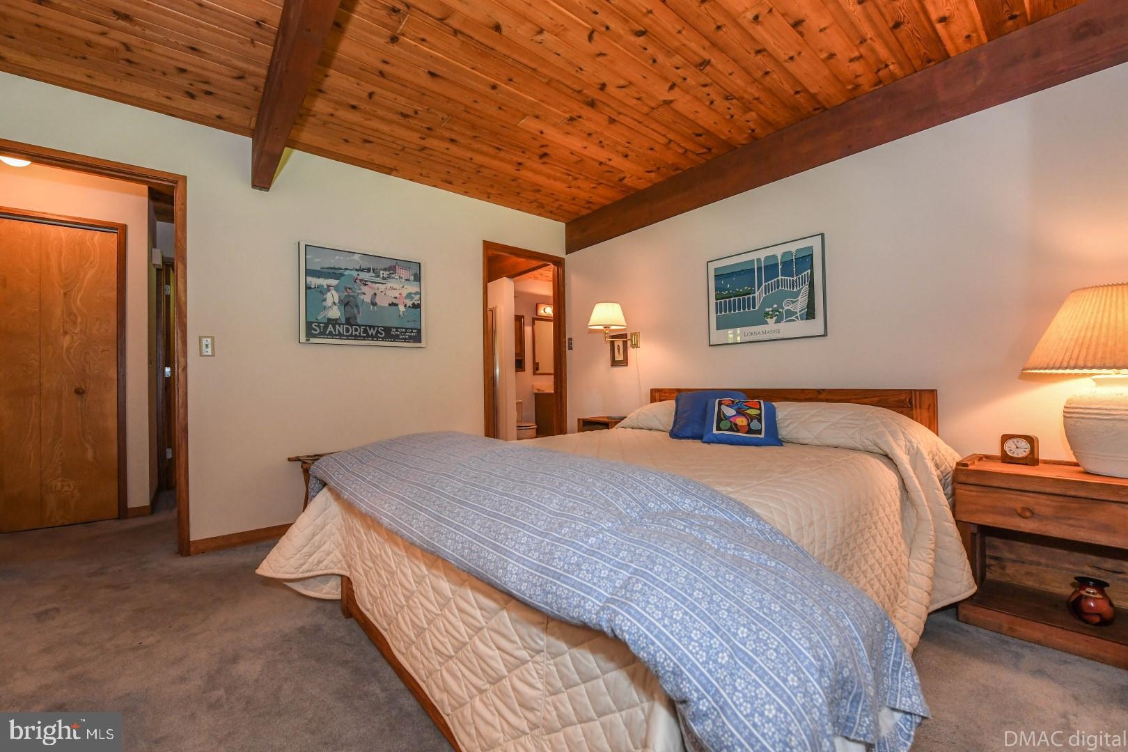1708 Dahlgren Road Middletown, MD 21769 - Photo 30 of 60 a bedroom with bed and paintings on the wall