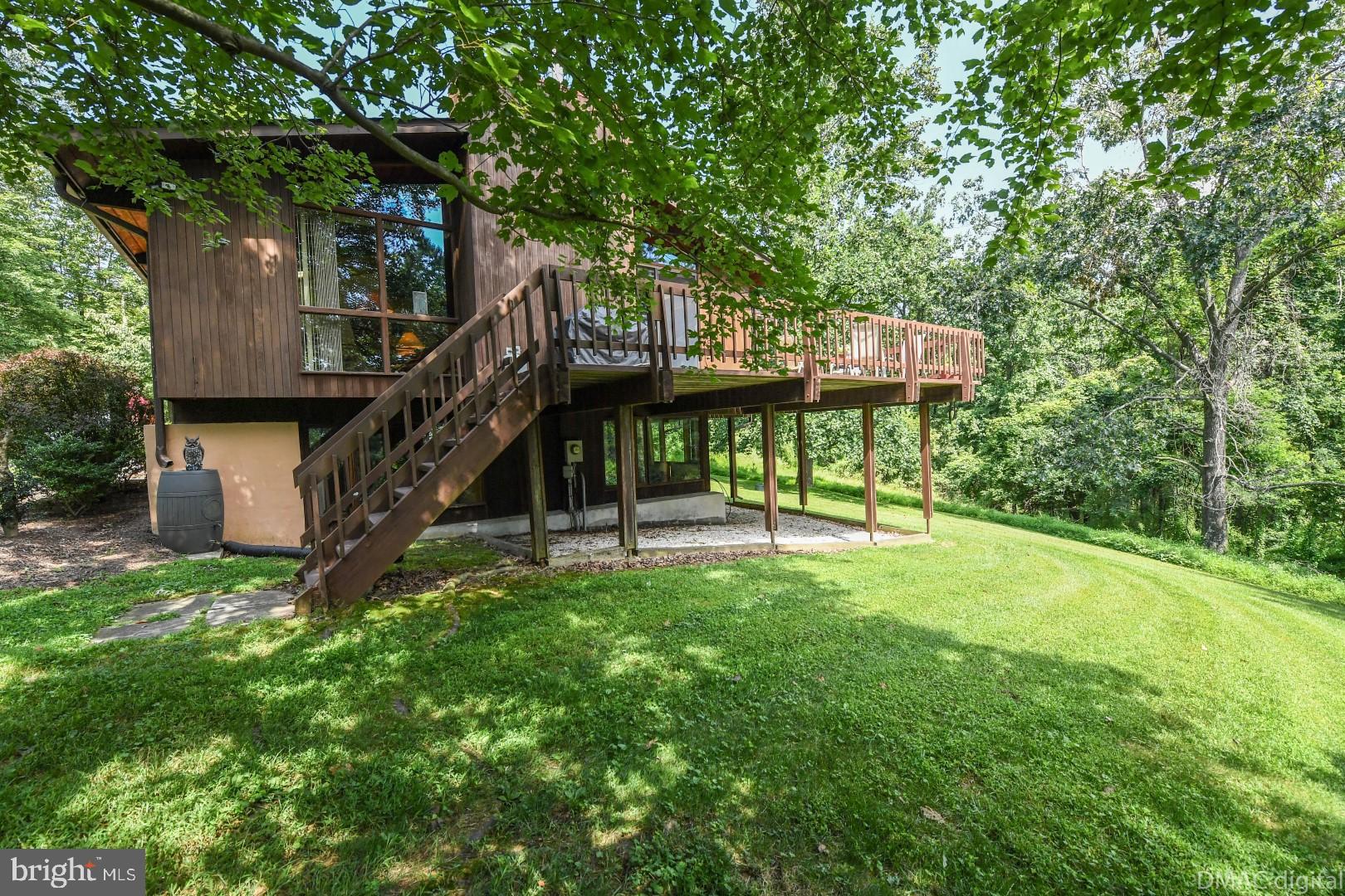 1708 Dahlgren Road Middletown, MD 21769 - Photo 39 of 60 a view of a deck with a table and chairs