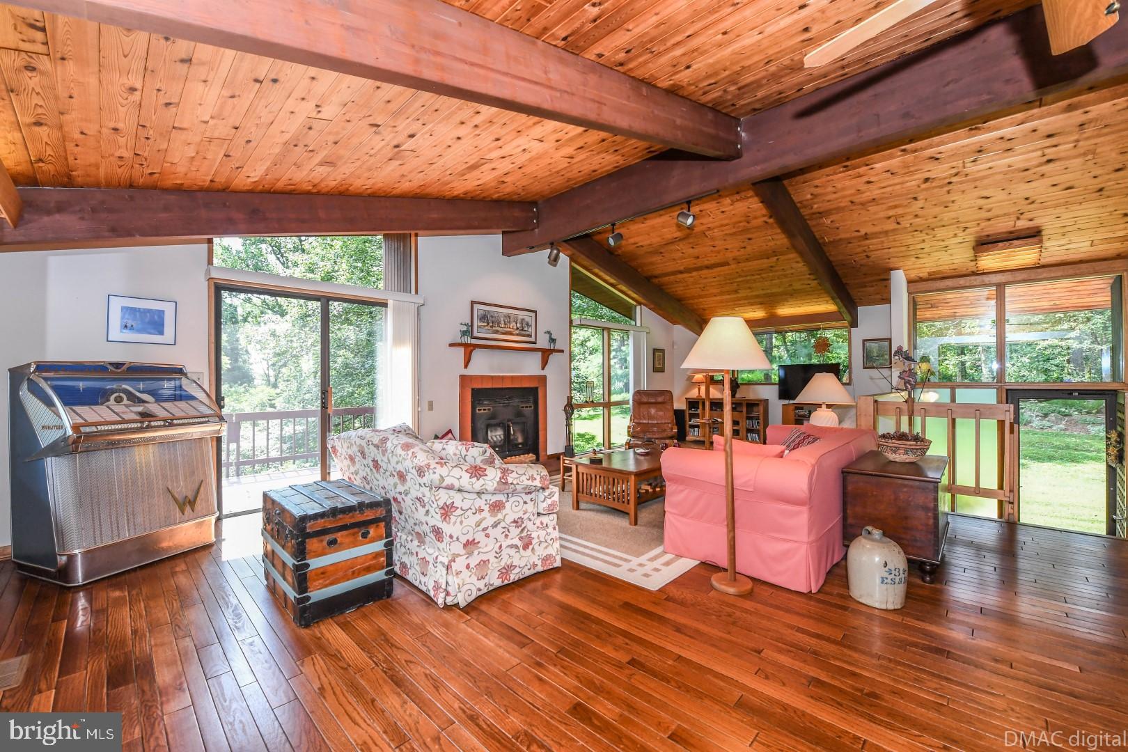 1708 Dahlgren Road Middletown, MD 21769 - Photo 5 of 60 a living room with furniture a wooden floor and a large window