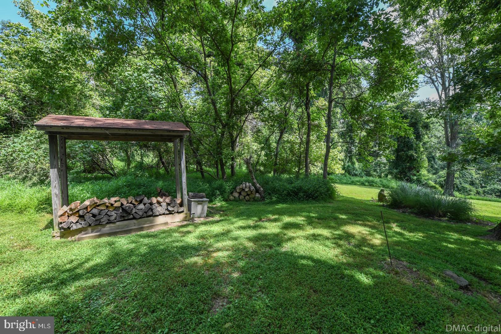 1708 Dahlgren Road Middletown, MD 21769 - Photo 52 of 60 a backyard of a house with lots of green space and outdoor seating