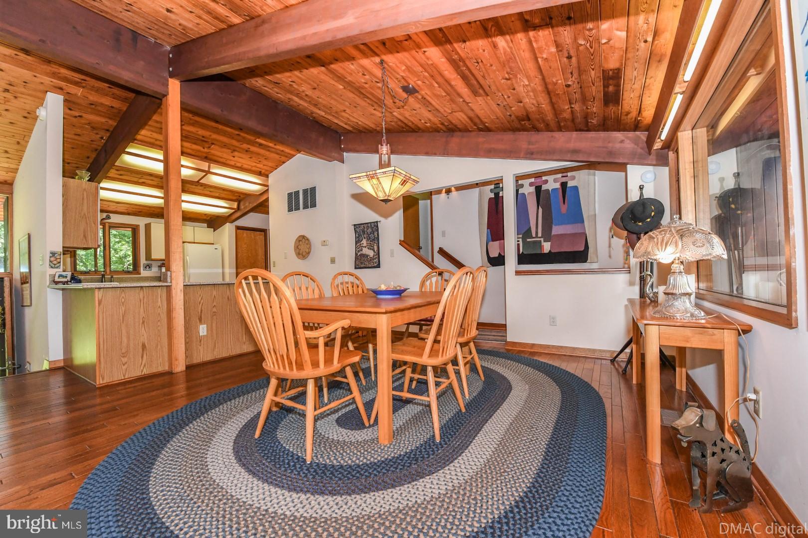 1708 Dahlgren Road Middletown, MD 21769 - Photo 8 of 60 a dining room with furniture wooden floor and a rug