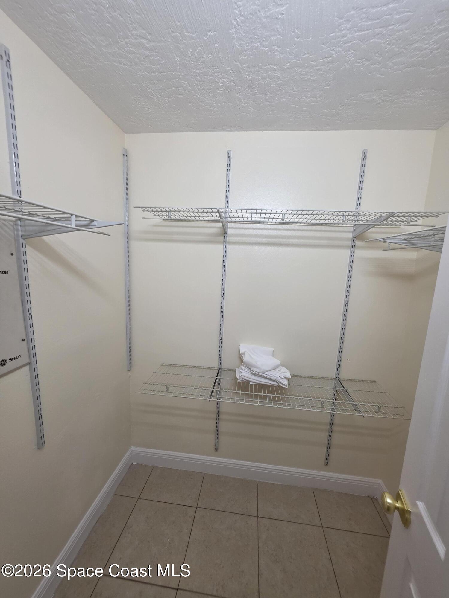 189 Cambridge Lane Melbourne, FL 32935 - Photo 14 of 14 a bathroom with a shower