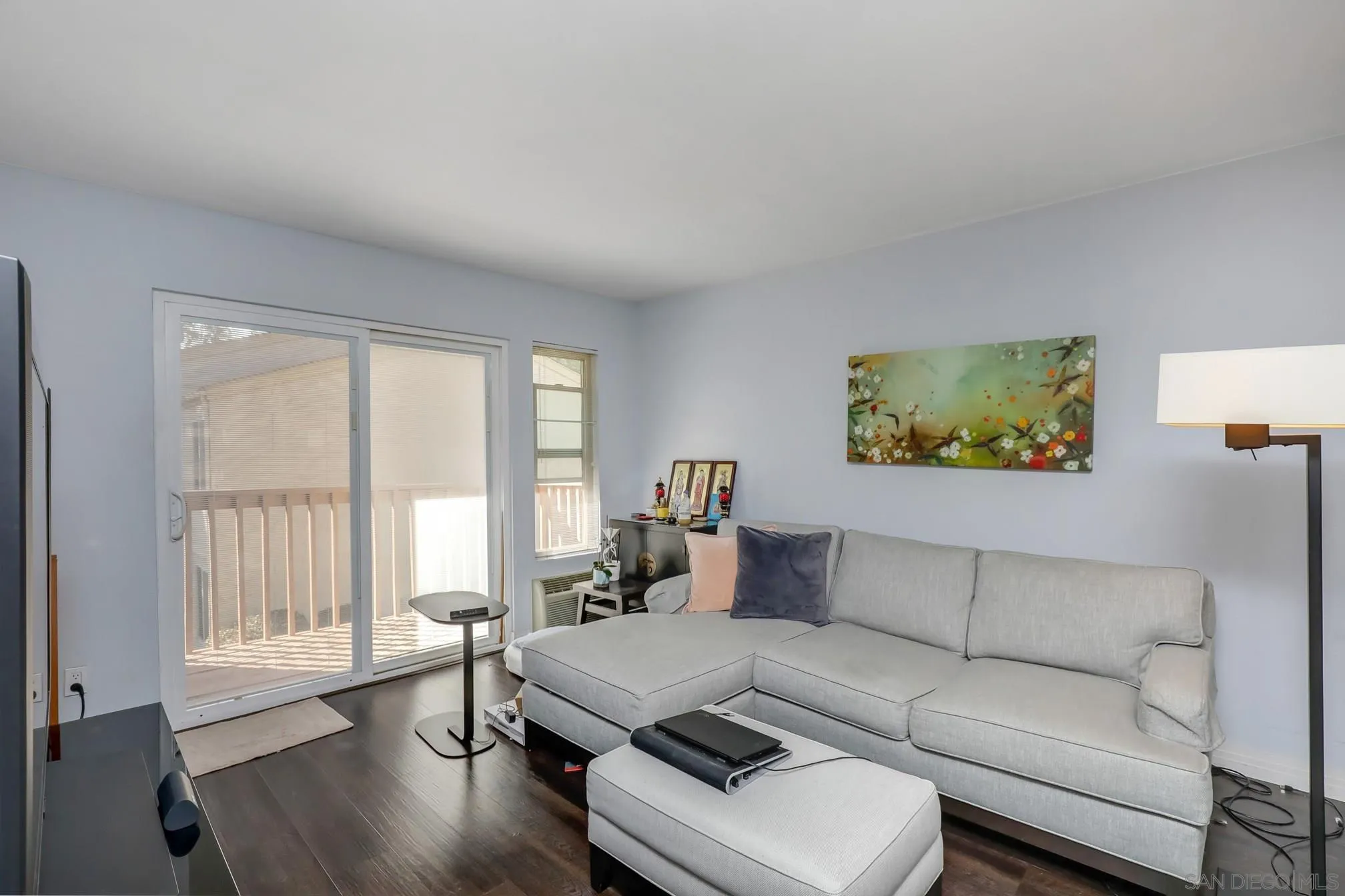 5910 Rancho Mission Road, Unit 40 San Diego, CA 92108 - Photo 1 of 17 a living room with furniture and a large window