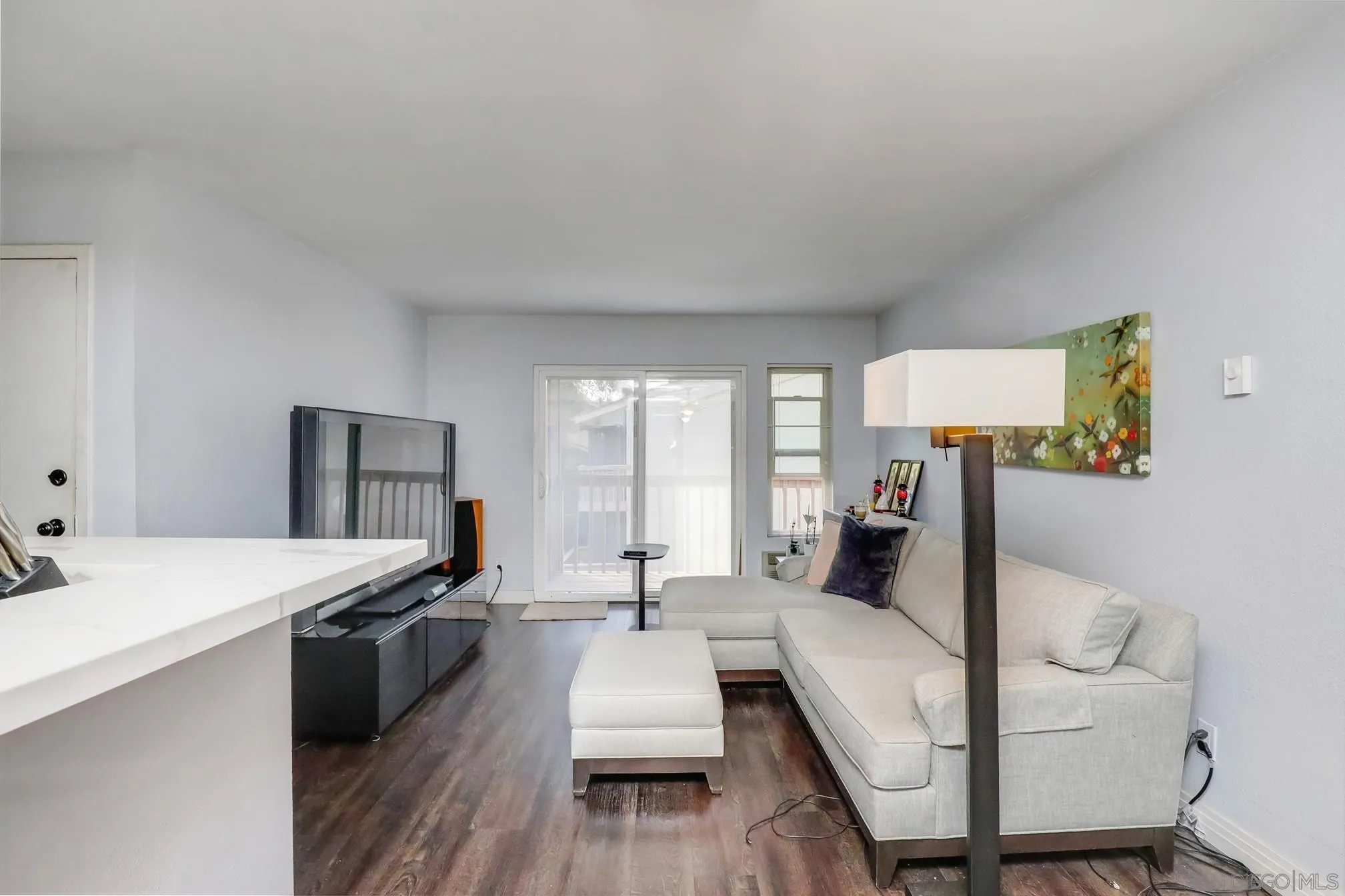 5910 Rancho Mission Road, Unit 40 San Diego, CA 92108 - Photo 2 of 17 a living room with furniture and a large window
