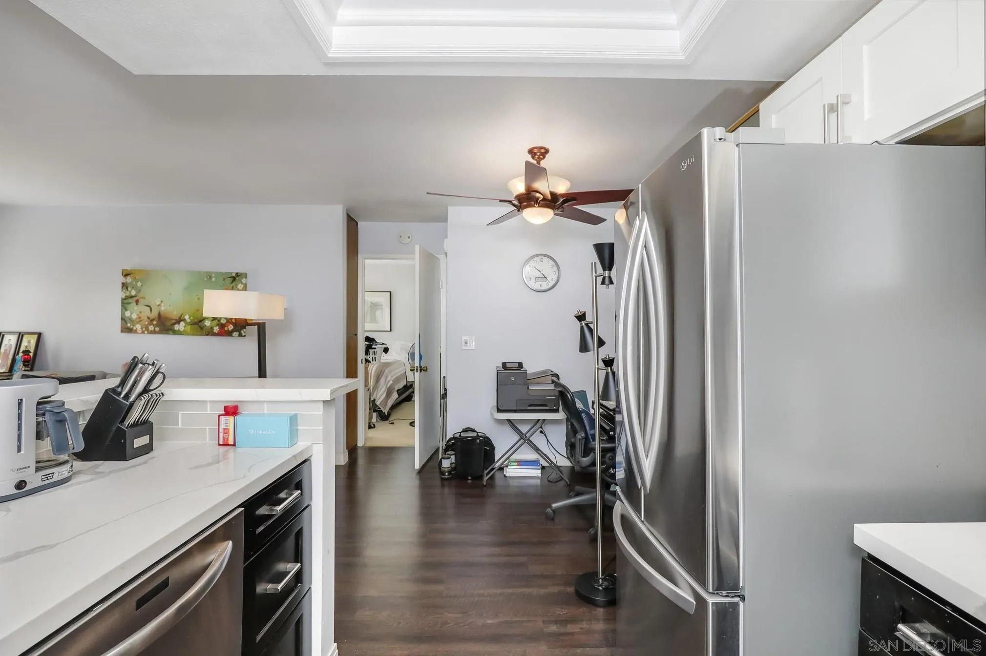 5910 Rancho Mission Road, Unit 40 San Diego, CA 92108 - Photo 5 of 17 a view of a kitchen with a table and chairs in it