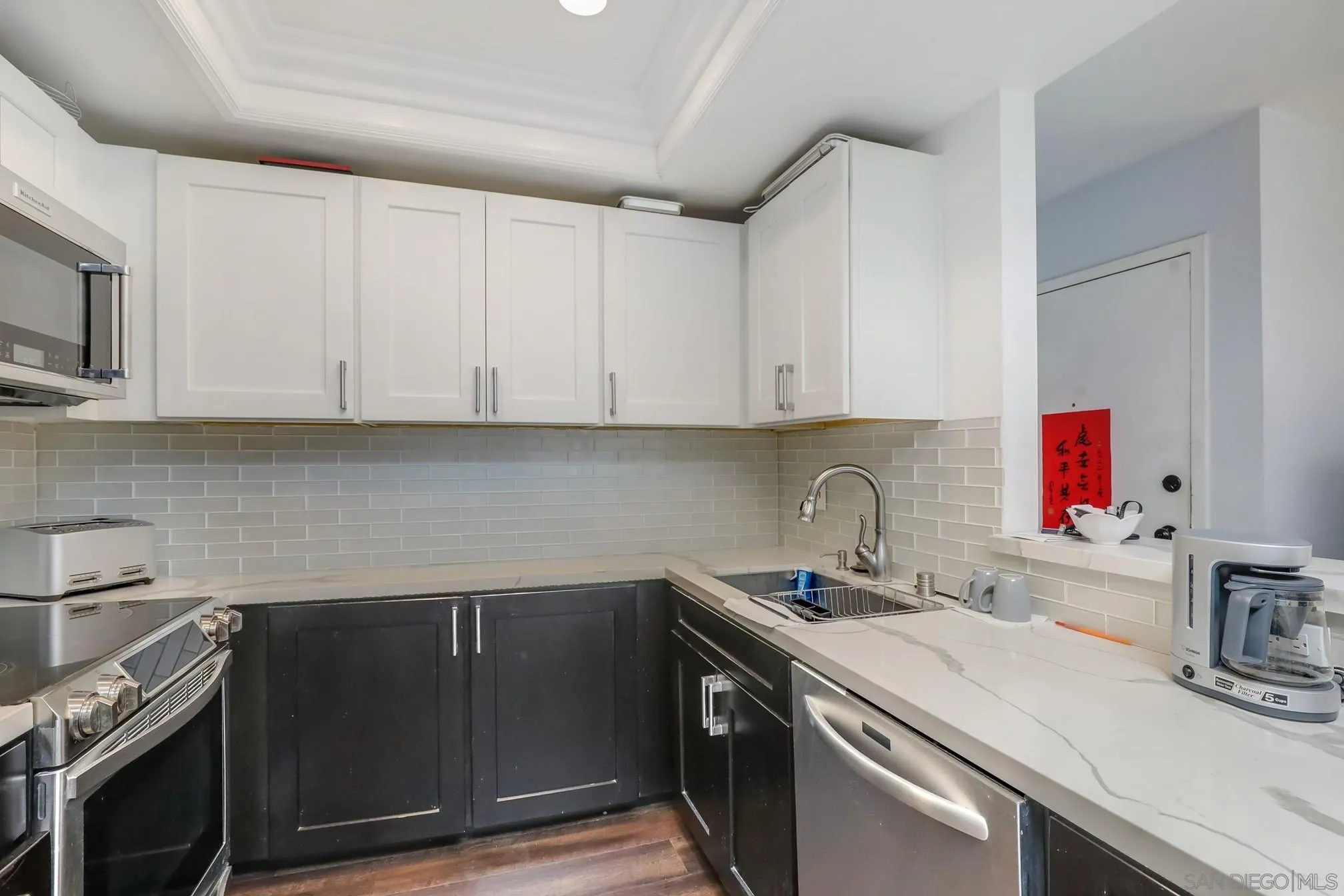 5910 Rancho Mission Road, Unit 40 San Diego, CA 92108 - Photo 8 of 17 a kitchen with a sink and cabinets
