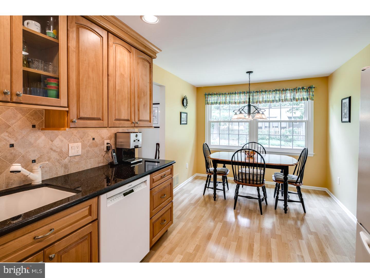 118 Fenwick Road Cherry Hill, NJ 08034 - Photo 8 of 24 a kitchen with granite countertop a dining table chairs and large window