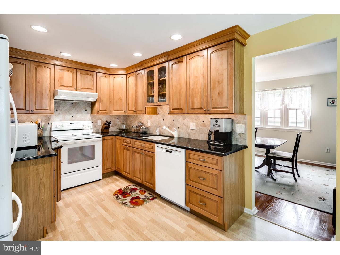 118 Fenwick Road Cherry Hill, NJ 08034 - Photo 10 of 24 a kitchen with stainless steel appliances granite countertop a stove a sink dishwasher a microwave oven with granite countertops and cabinets