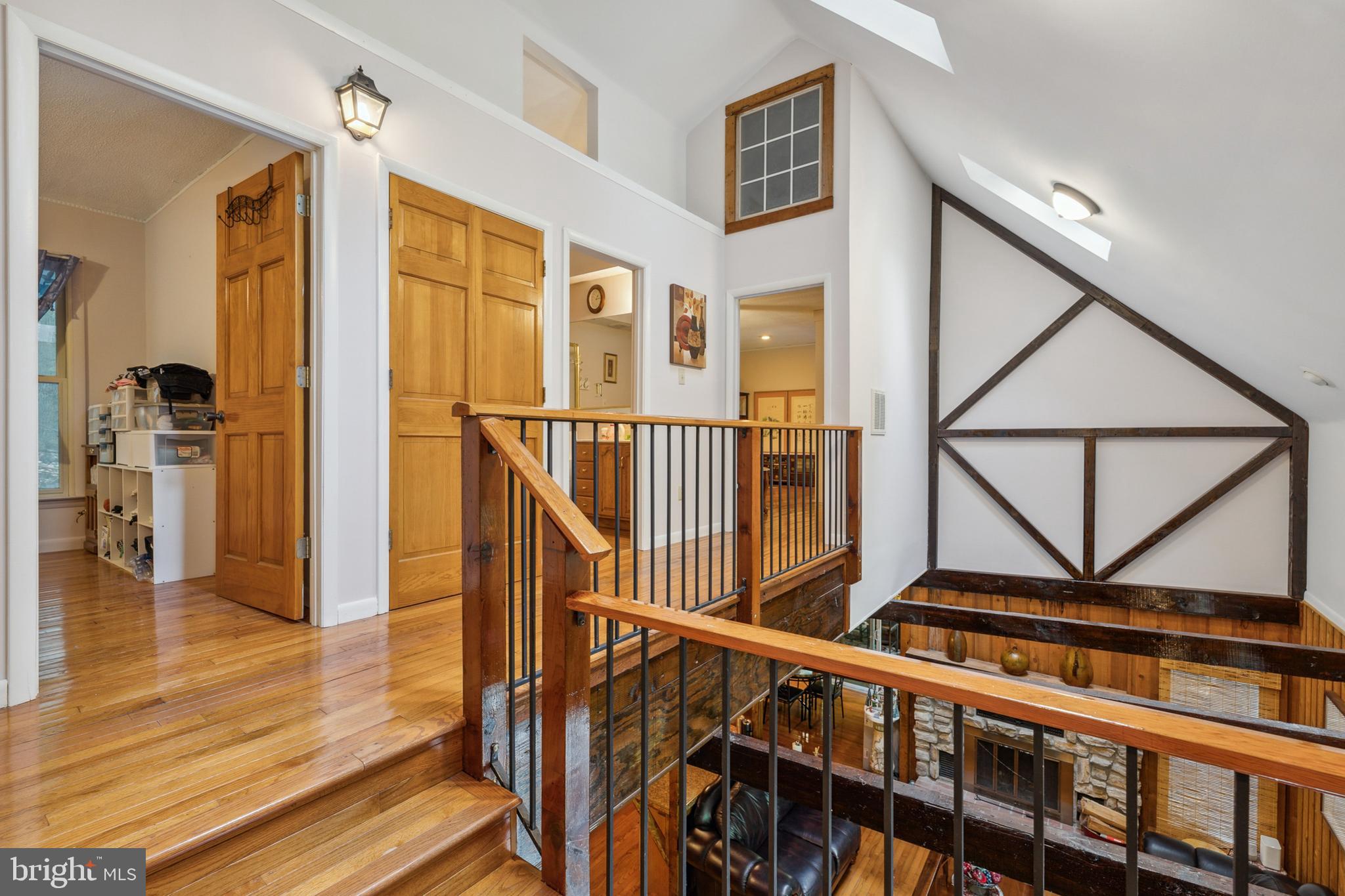 929 High Knob Road Front Royal, VA 22630 - Photo 16 of 30 a view of a hallway with wooden floor and staircase