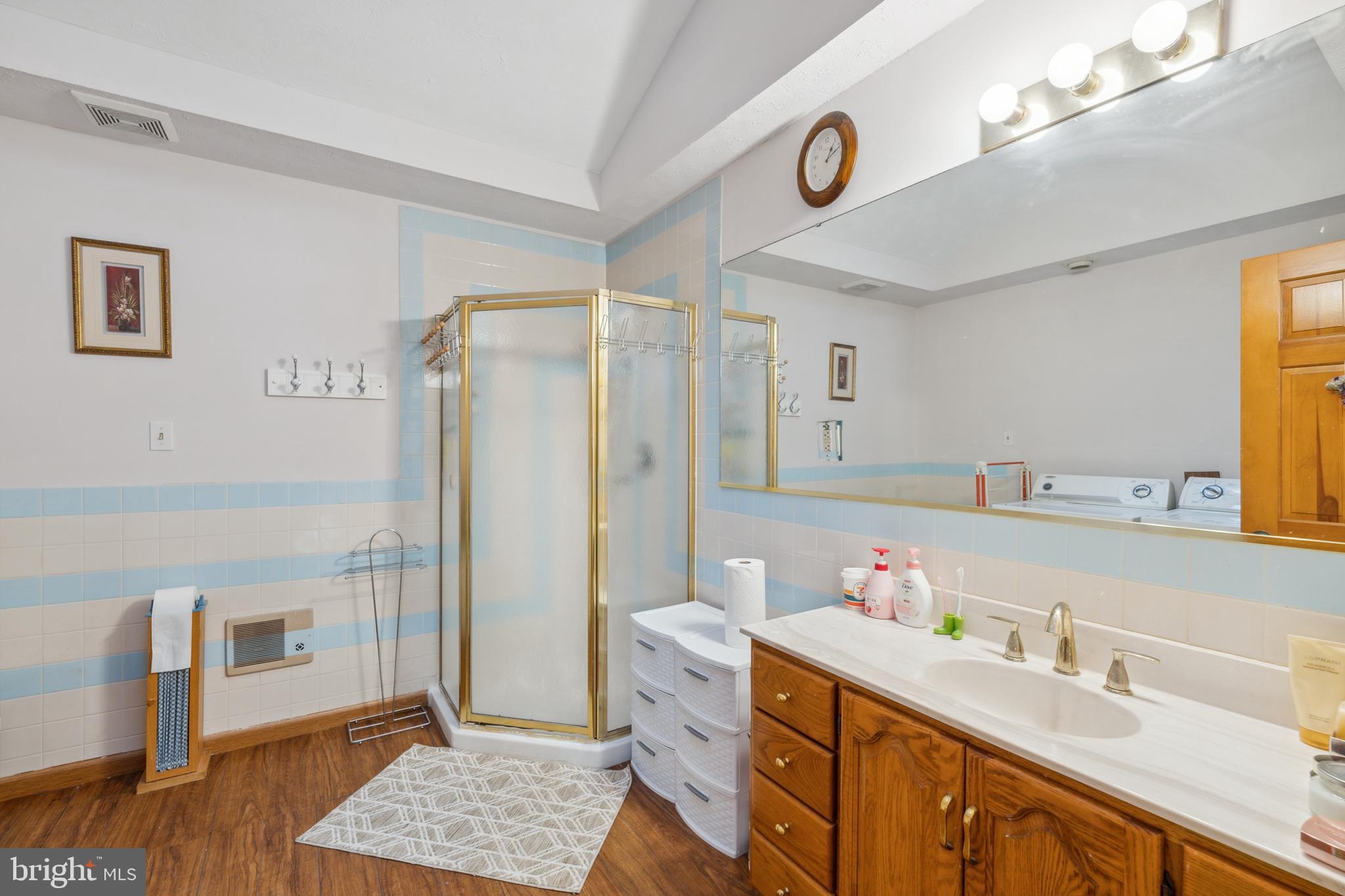 929 High Knob Road Front Royal, VA 22630 - Photo 17 of 30 a spacious bathroom with a double vanity sink a mirror and a shower