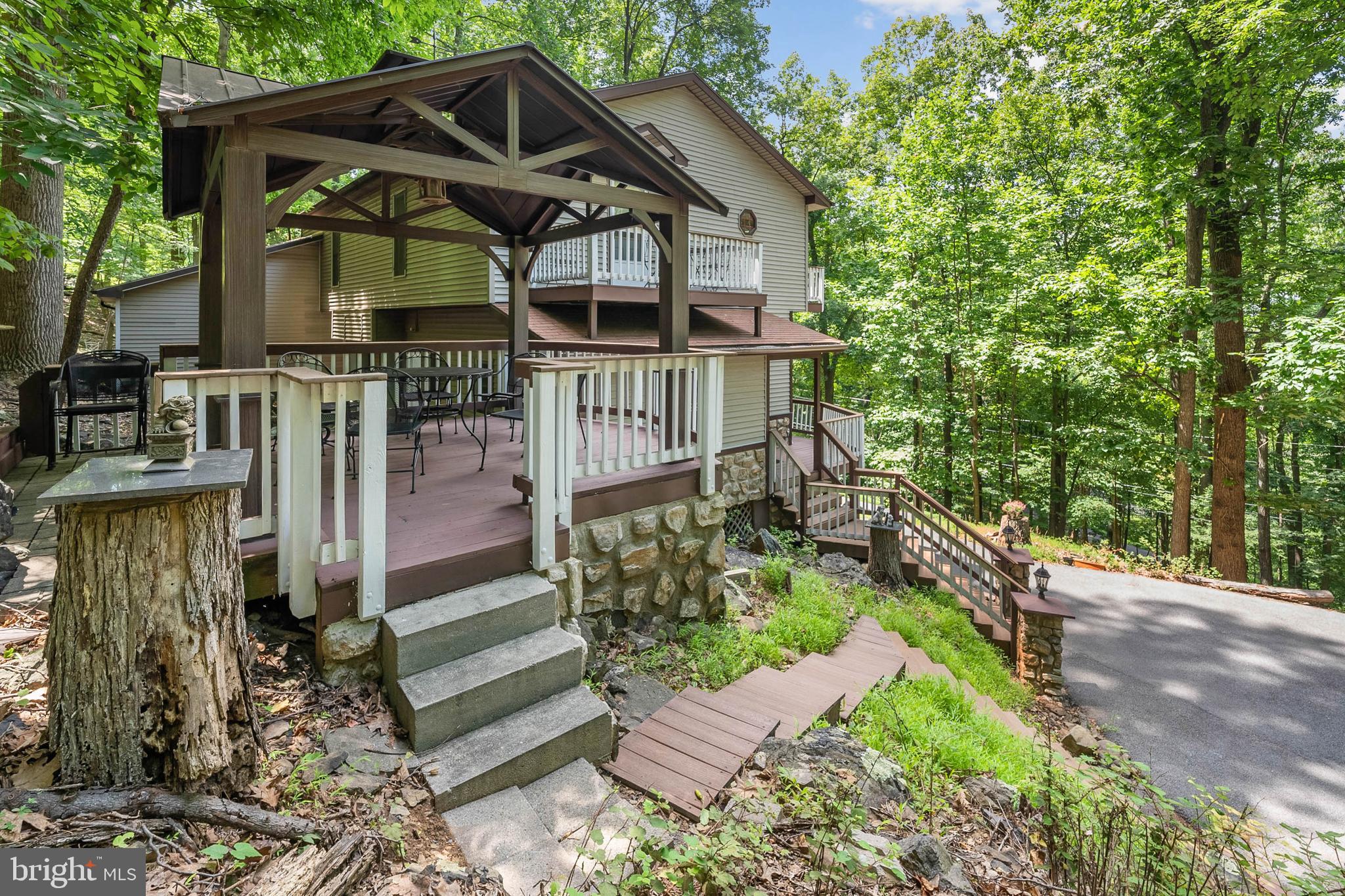 929 High Knob Road Front Royal, VA 22630 - Photo 23 of 30 a front view of a house with garden