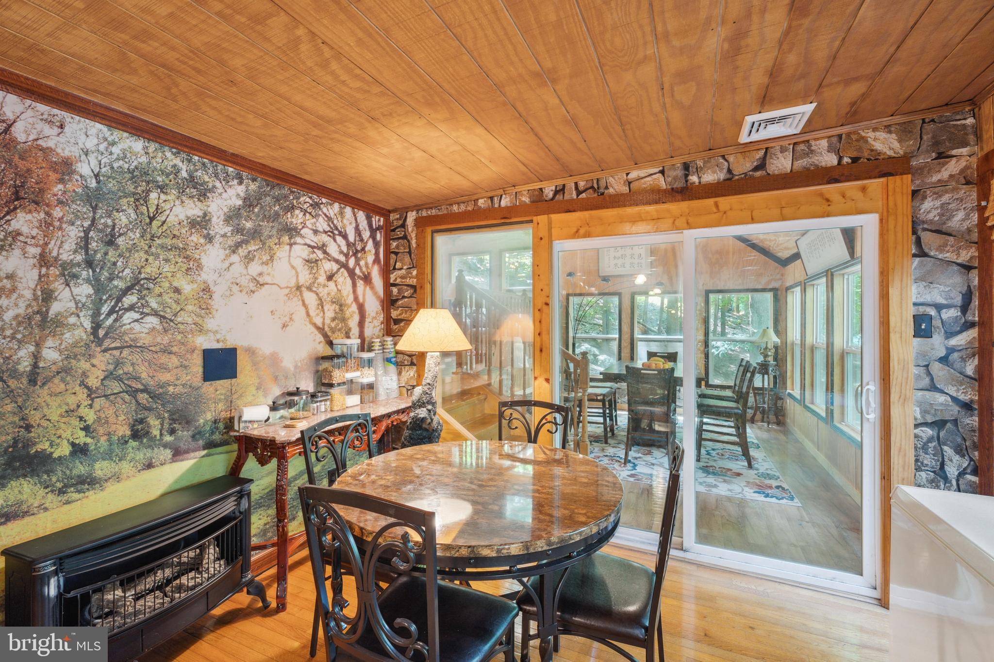 929 High Knob Road Front Royal, VA 22630 - Photo 10 of 30 a view of a dining room with furniture window and outside view