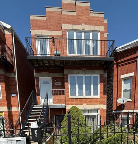 a front view of residential houses with stairs