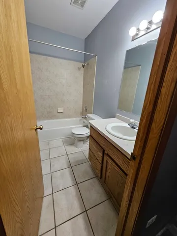 a bathroom with a sink a toilet and a shower