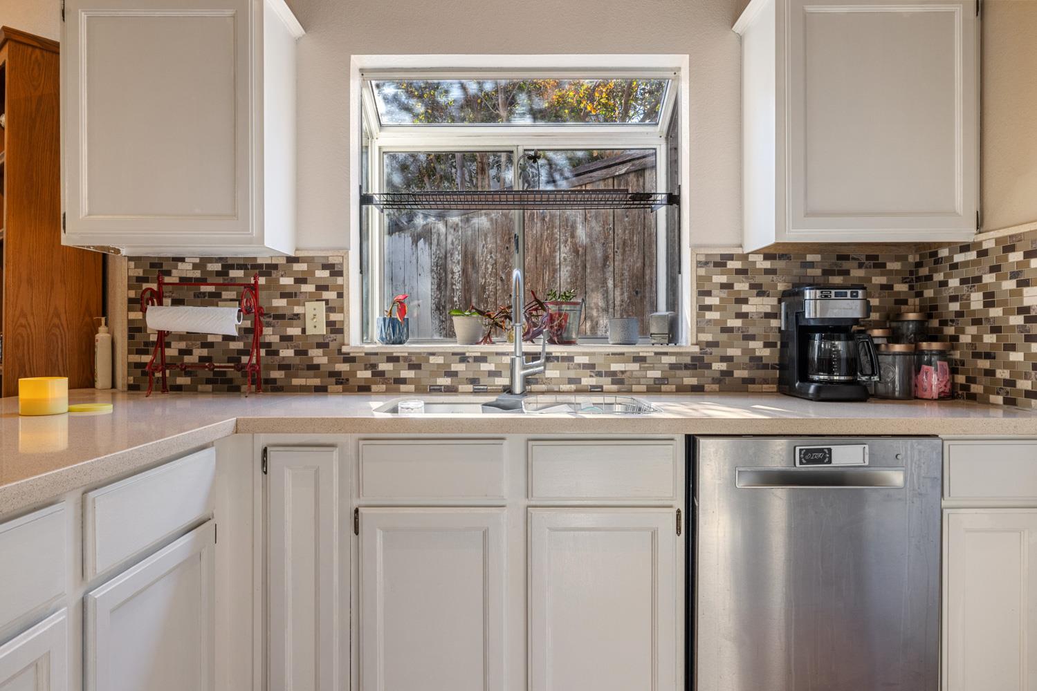 2812 Stone Terrace Modesto, CA 95355 - Photo 15 of 33 a kitchen with stainless steel appliances granite countertop a sink and cabinets
