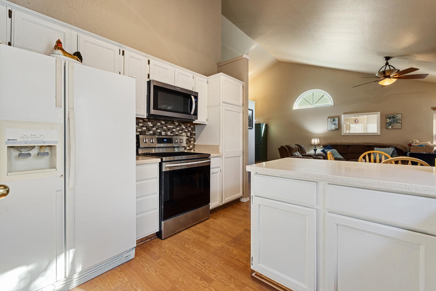 2812 Stone Terrace Modesto, CA 95355 - Photo 16 of 33 a kitchen with stainless steel appliances a refrigerator stove and sink