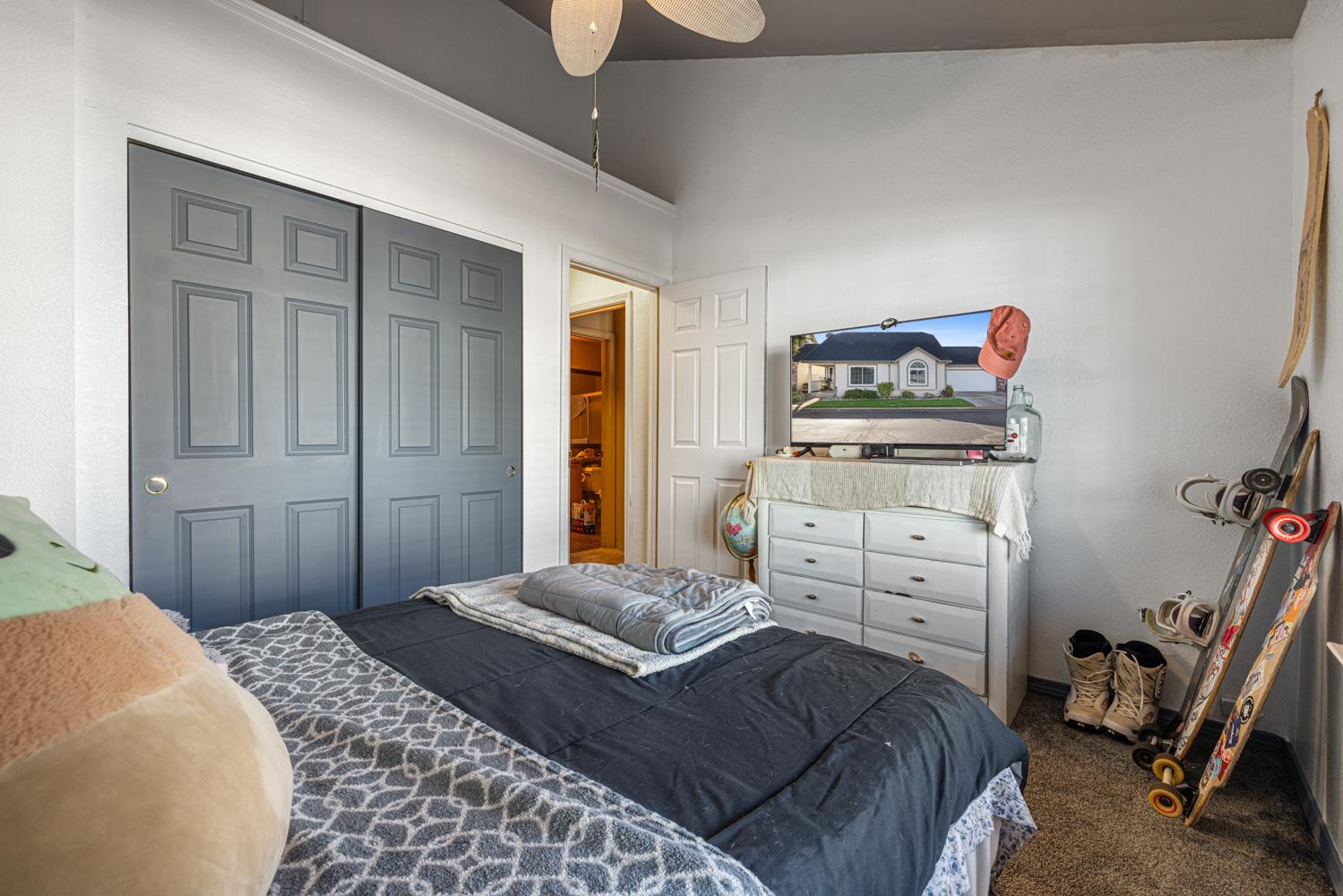 2812 Stone Terrace Modesto, CA 95355 - Photo 23 of 33 a bedroom with a bed and wooden floor