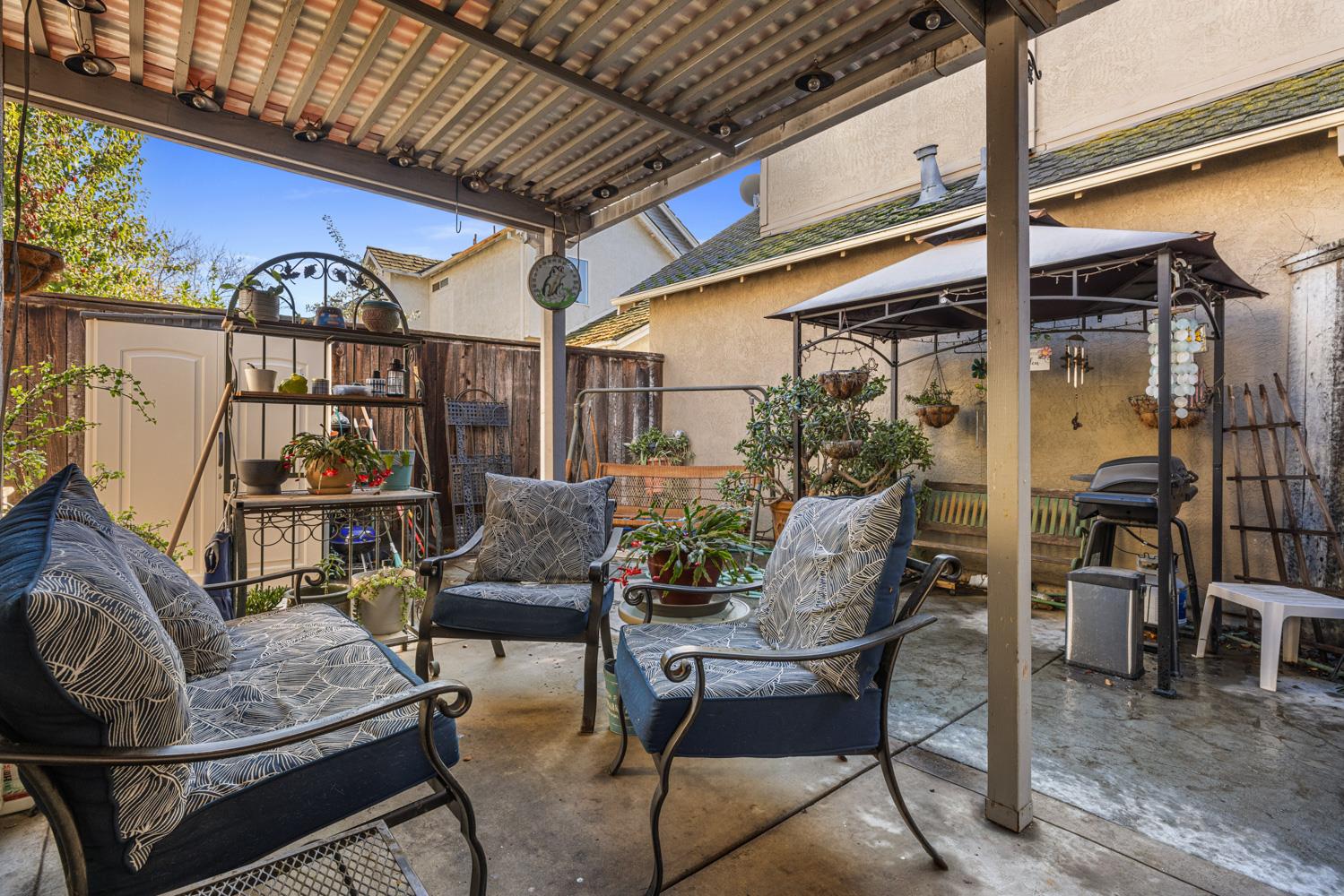 2812 Stone Terrace Modesto, CA 95355 - Photo 30 of 33 a patio with glass top table and chairs