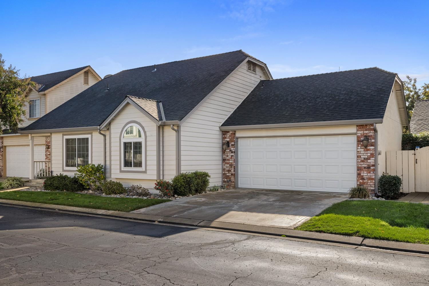 2812 Stone Terrace Modesto, CA 95355 - Photo 5 of 33 a front view of a house with a yard and garage