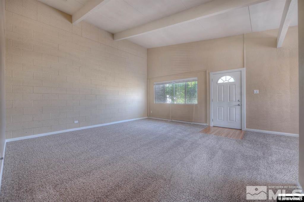 12002 Andes Street Reno, NV 89506 - Photo 5 of 12 an empty room with windows and closet