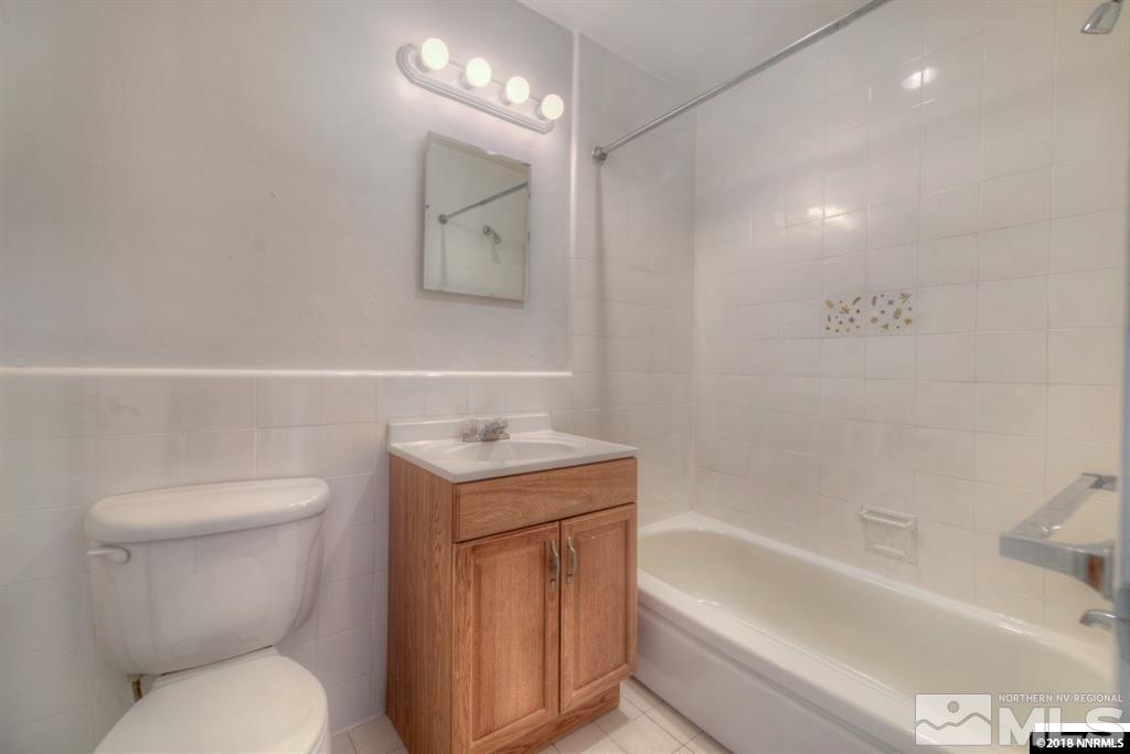 12002 Andes Street Reno, NV 89506 - Photo 6 of 12 a bathroom with a toilet sink and bathtub