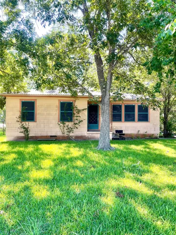 a backyard of a house with seating space