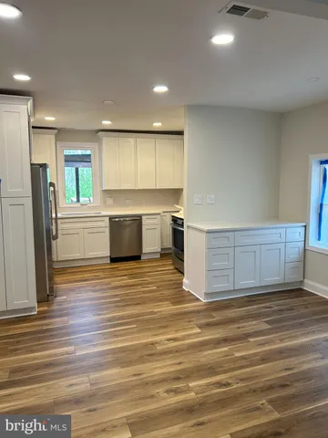 a view of a kitchen with a sink