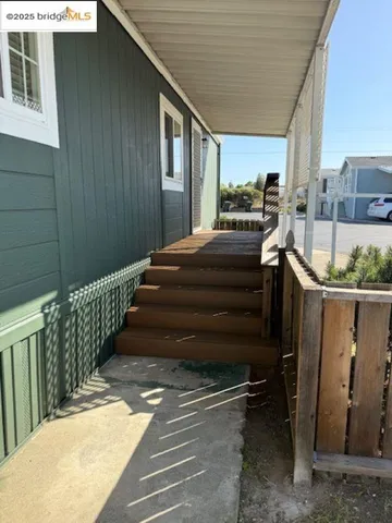a balcony view with a backyard space