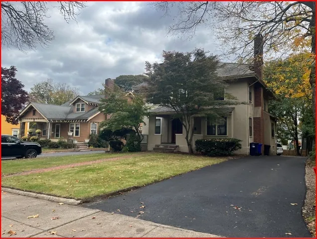 a view of street with parked cars