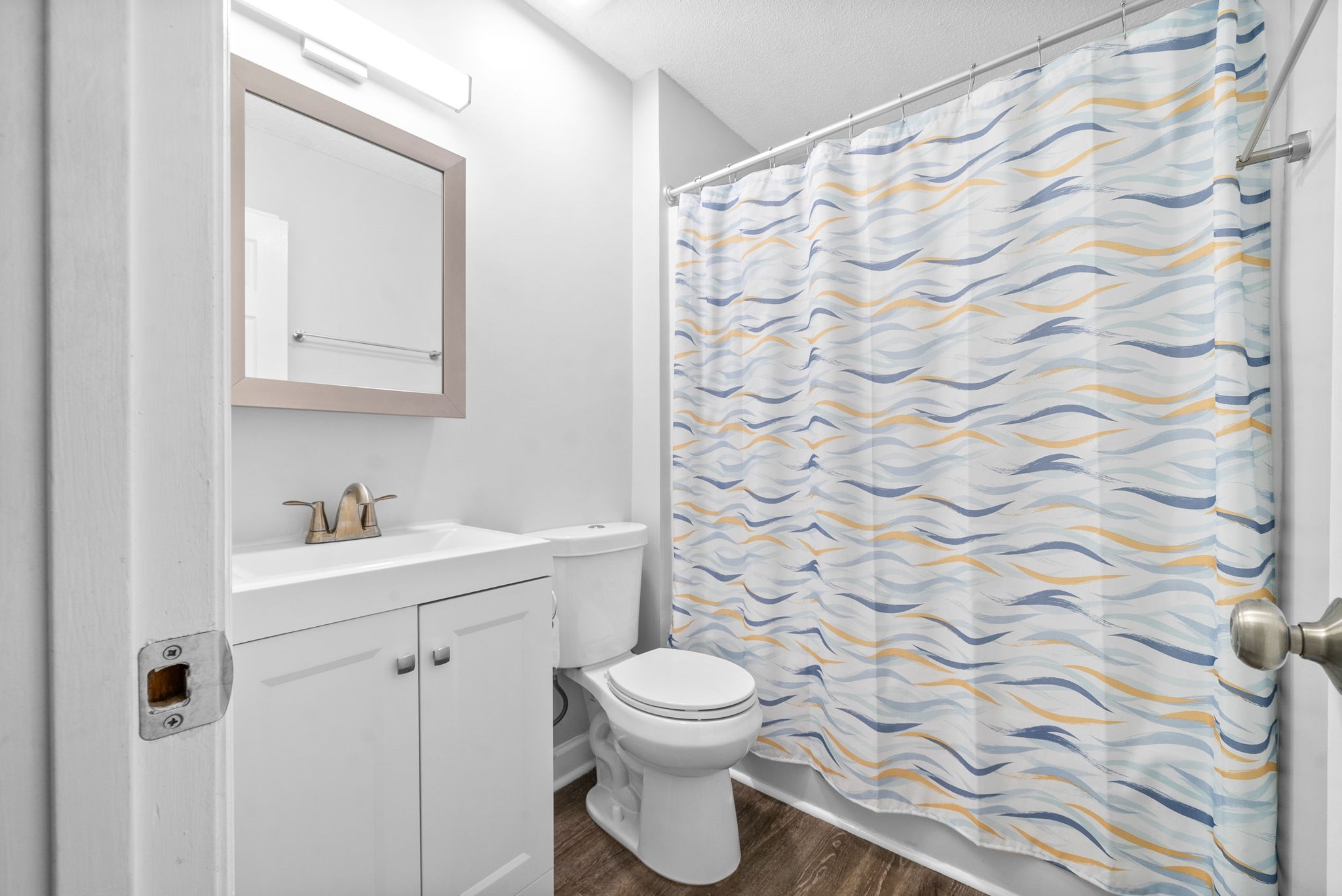 1301 Neelys Bend Road, Unit 22 Madison, TN 37115 - Photo 4 of 22 a bathroom with a toilet a sink and a mirror