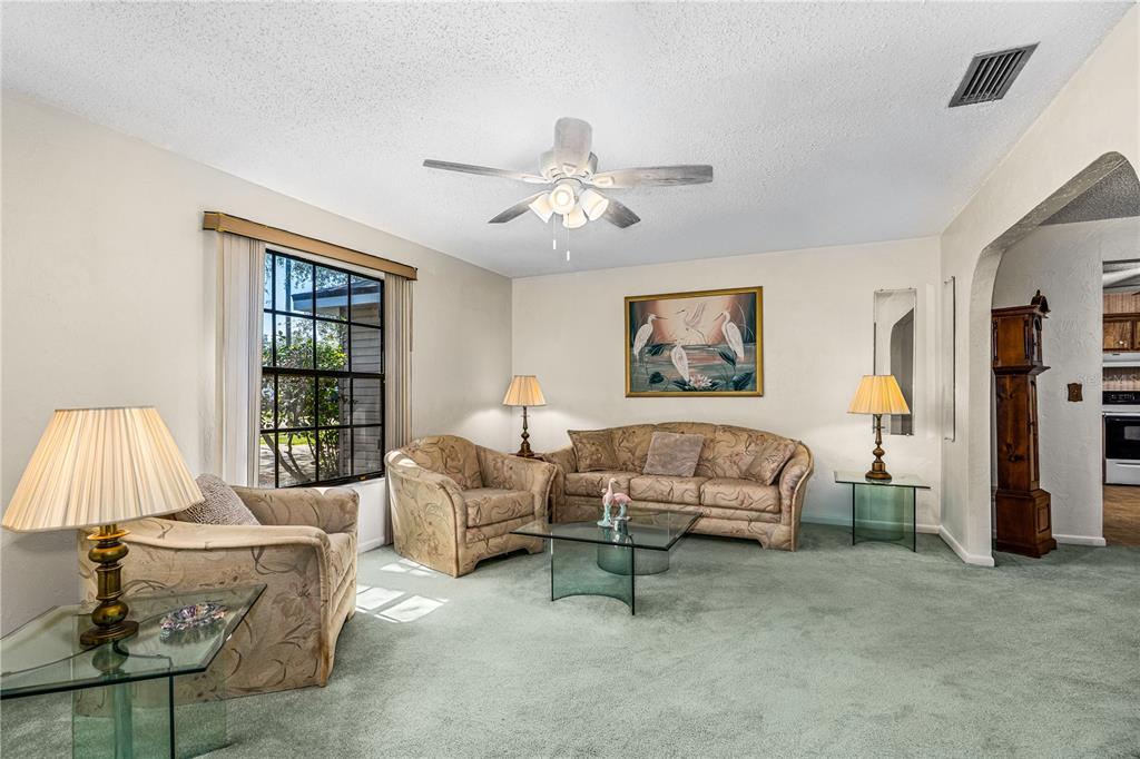 693 Reillys Road Port Orange, FL 32127 - Photo 9 of 31 a living room with furniture and a window