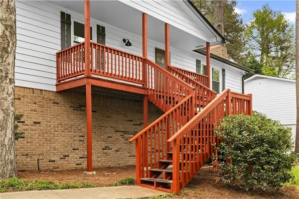 a view of a balcony with wooden floor