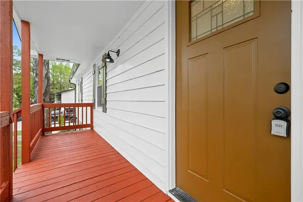 a view of a house with a yard and sitting area