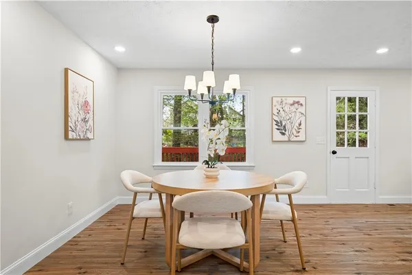 a dining room with furniture and window