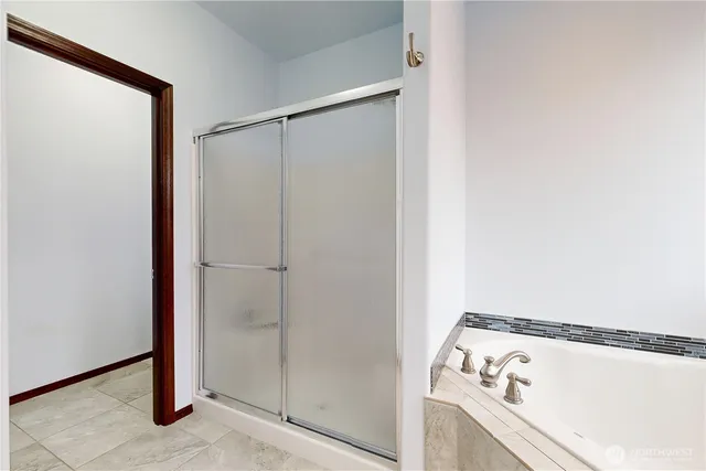 a bathroom with a bathtub and a sink