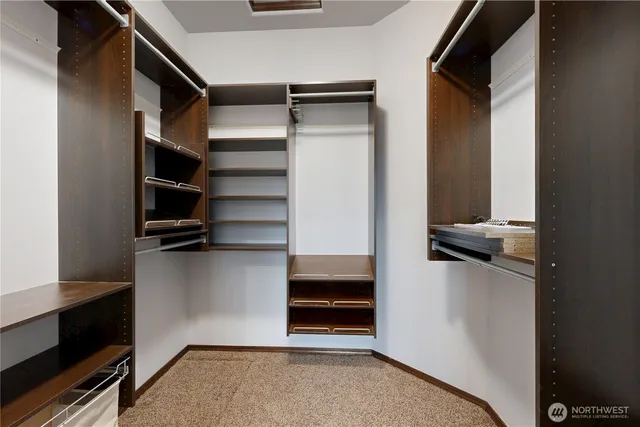 a white toilet sitting next to a small bathroom