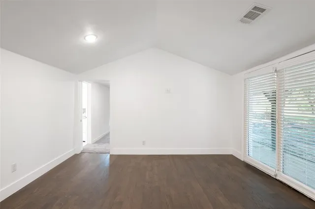 an empty room with a empty space and window