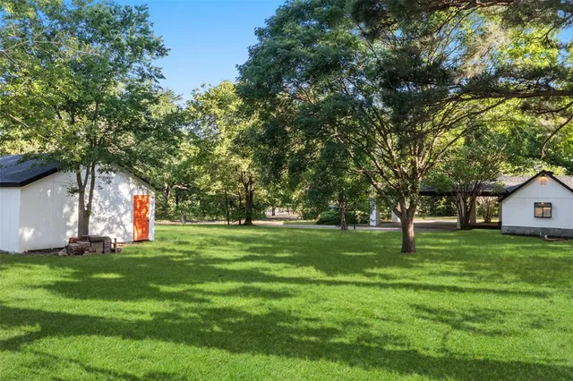 a view of a trees in front of a house