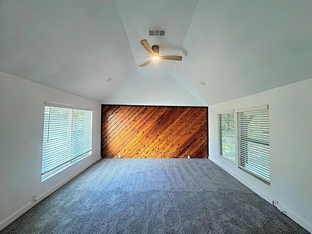 a bathroom with a granite countertop sink toilet a large mirror and shower
