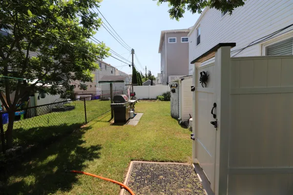 a view of a back yard of the house