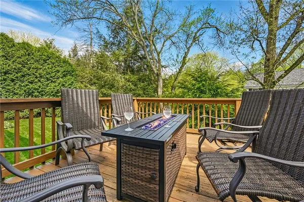 a view of a chairs on wooden deck