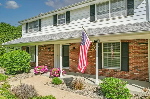 a front view of a house with a porch